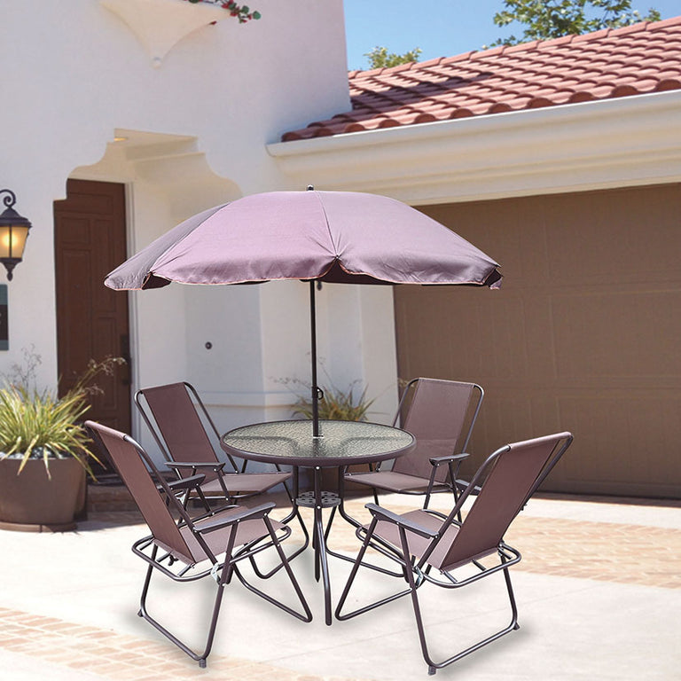 Conjunto de jardín Málaga con mesa de cristal, 4 sillas plegables marrones y parasol central en patio.
