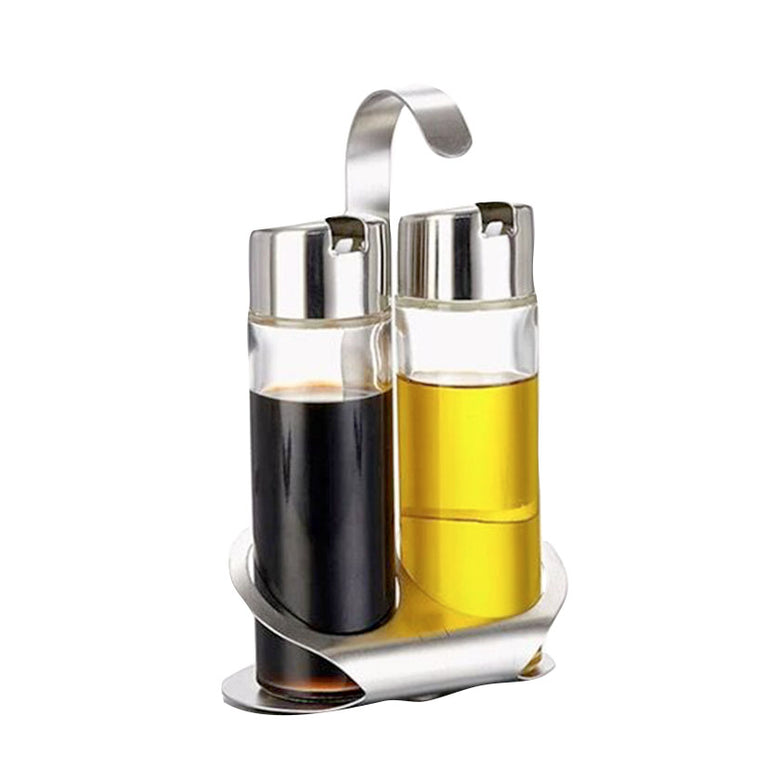 Aceitera y vinagrera HABITEX Twin de 2 piezas con base de acero inoxidable y sistema antigoteo.