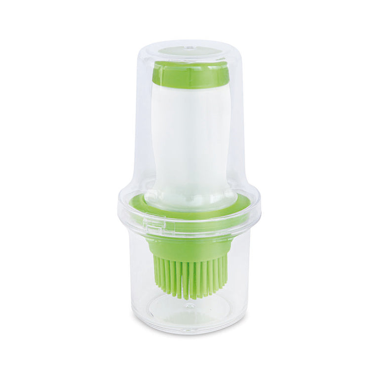 Aceitera con pincel de silicona Iris 60ml con tapa protectora transparente y detalles en color verde.