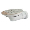 Válvula sifónica para plato de ducha Crearplast C-97 con rejilla de acero inoxidable y salida horizontal blanca.