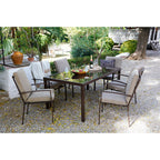 Comedor de jardín completo con mesa y seis sillones Madeira en ambiente exterior
