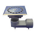 Sumidero sifónico Tecnoagua T-88 VHI con rejilla de acero inoxidable y cuerpo de PVC gris para evacuación de agua.