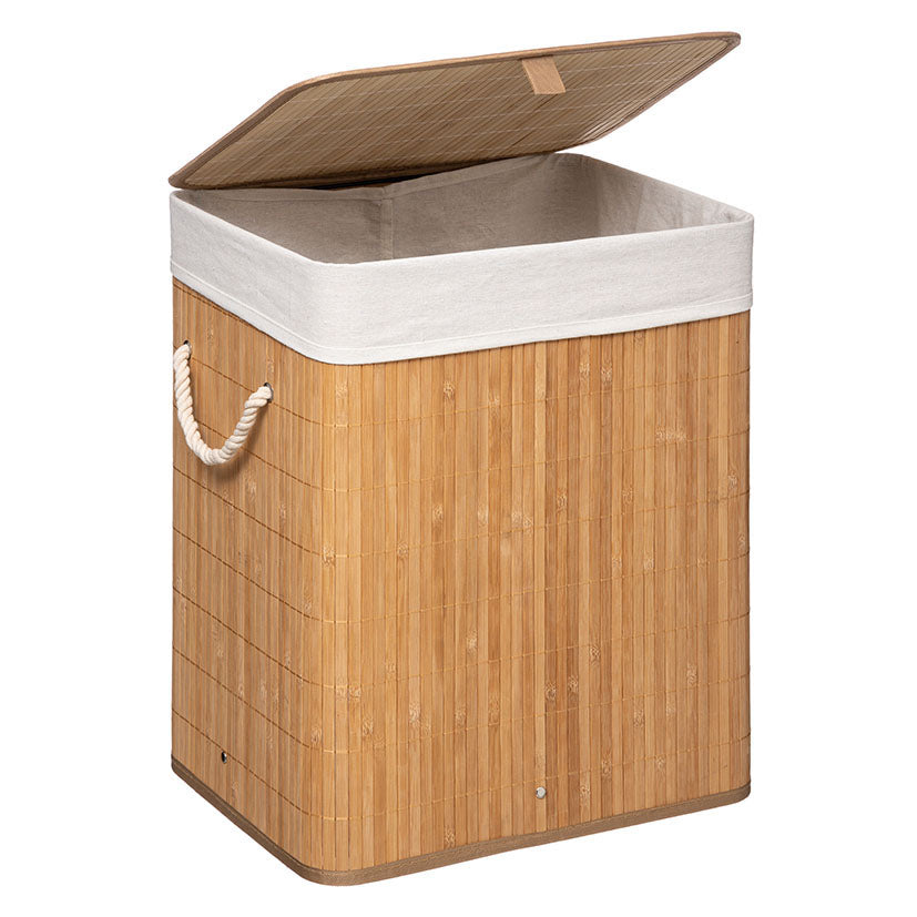 Cesta de lavandería de bambú abierta mostrando la bolsa interior de algodón blanco extraíble y lavable.