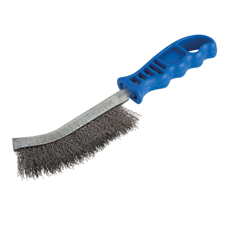 Cepillo de púas de acero Wolfcraft con mango azul, ideal para eliminar óxido en superficies metálicas.