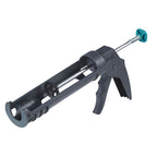 Pistola de silicona Wolfcraft MG 100 gris con gatillo ergonómico y varilla de empuje.