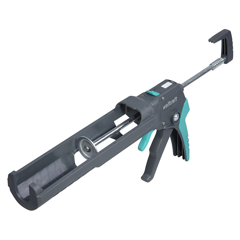 Pistola de cartuchos Wolfcraft MG 550 en color gris y turquesa con manguito giratorio.