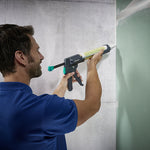 Aplicación de sellante en junta de pared vertical con pistola de alta presión Wolfcraft MG 600 PRO