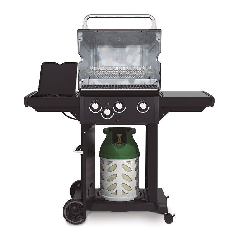 Interior de barbacoa Broil King Royal 340 Shadow mostrando parrillas de hierro y quemador lateral abierto