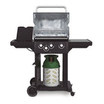 Interior de barbacoa Broil King Royal 340 Shadow mostrando parrillas de hierro y quemador lateral abierto