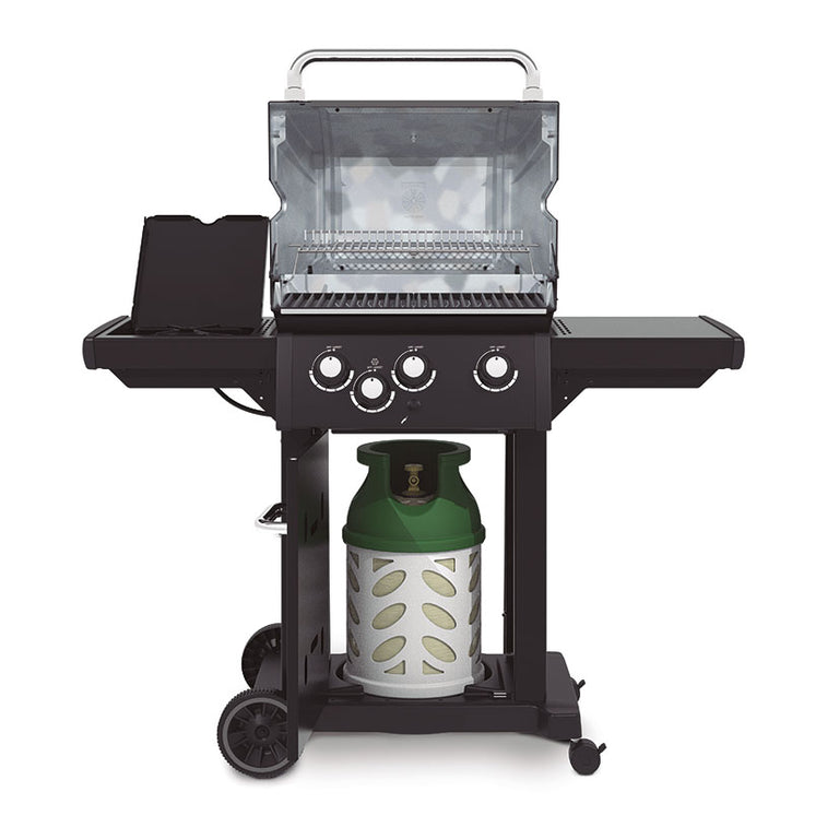 Interior de barbacoa Broil King Royal 340 Shadow mostrando parrillas de hierro y quemador lateral abierto