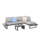 Conjunto de jardín modular Stelton en forma de L con cojines grises y mesa de centro negra