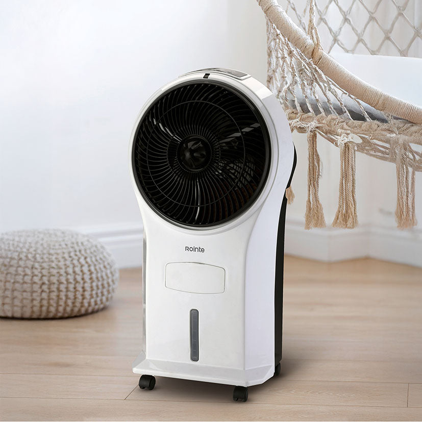 Climatizador portátil Rointe Aveiro Mini ubicado en un salón moderno junto a mobiliario de diseño