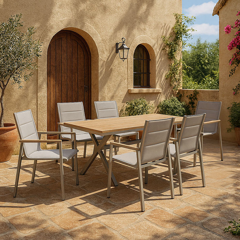 Comedor de exterior KMUS con mesa y seis sillas en una terraza de estilo mediterráneo.