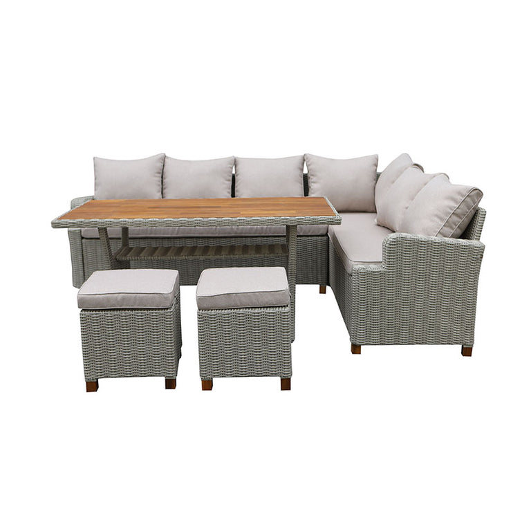 Conjunto de jardín esquinero Canaima de ratán gris con mesa de madera de acacia y dos puffs sobre fondo blanco.