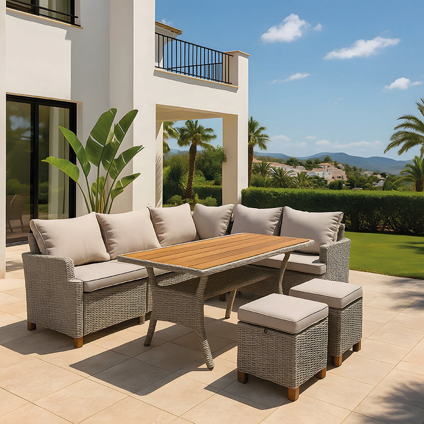 Set de muebles de exterior Canaima instalado en una terraza moderna con vistas al jardín y montaña.