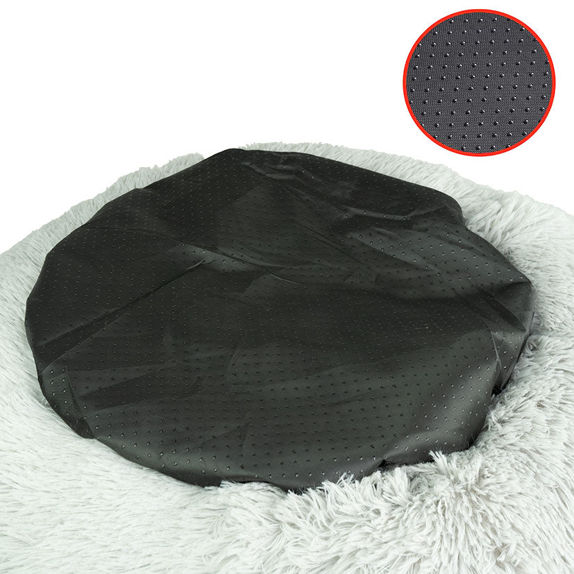Detalle de la base negra antideslizante con textura de puntos de la cama para mascotas