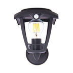 Aplique solar retro Xanlite ASN400 negro con bombilla de filamento LED vista y sensor de movimiento frontal.