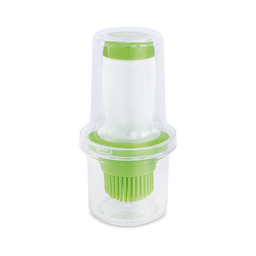 Aceitera con pincel de silicona Iris 60ml con tapa protectora transparente y detalles en color verde.