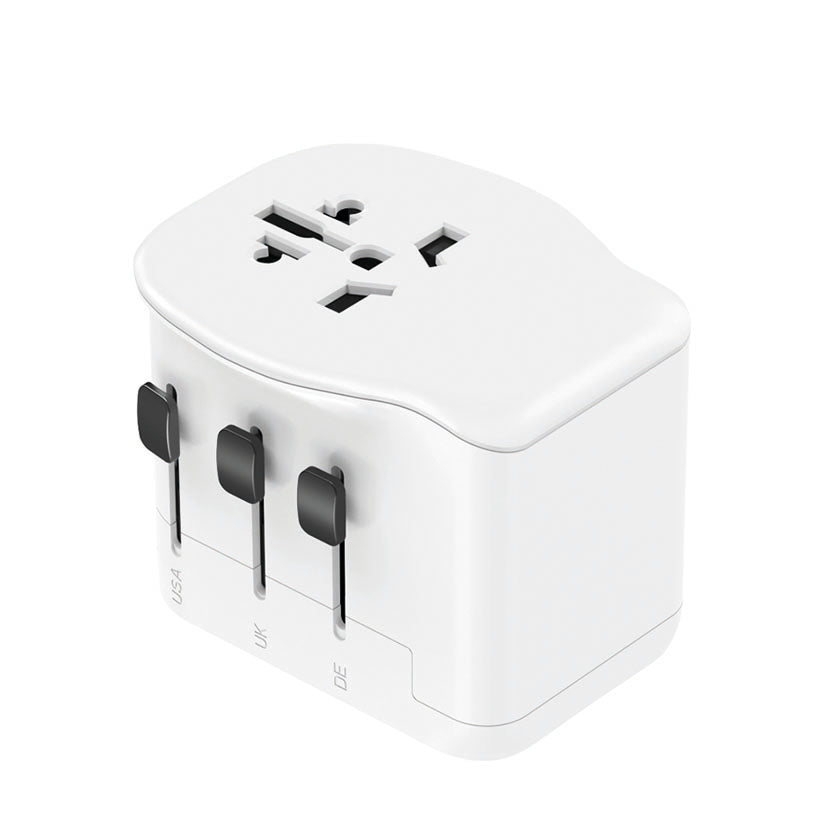 Adaptador de viaje universal blanco con selectores para enchufes USA, UK y DE.